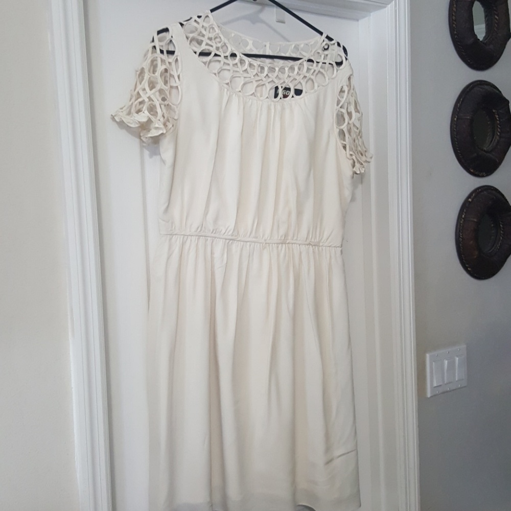 Cream colored dress with nice detail.
